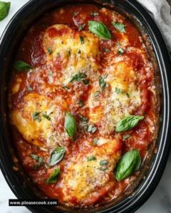 Delicious Crockpot Chicken Parmesan with marinara sauce and melted cheese