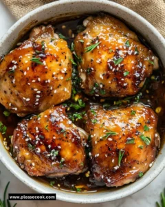 Delicious crockpot teriyaki chicken served on a plate with garnishes.