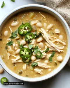 A bowl of delicious Crockpot white chicken chili topped with fresh cilantro.