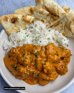 Delicious homemade butter chicken served with rice and garnished with cilantro