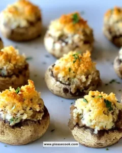 3-Cheese Stuffed Mushrooms on a platter, ready to serve as an appetizer.