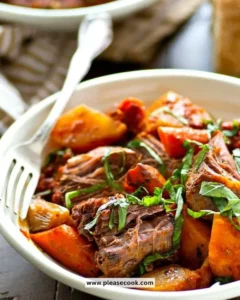 Beef pot roast with root vegetables served in a rustic dish