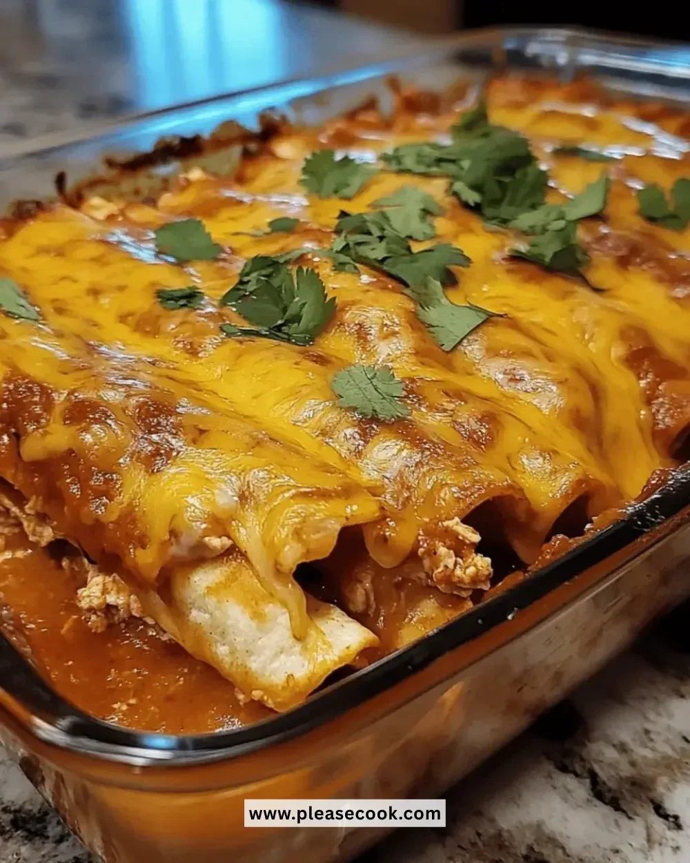 Delicious cheesy chicken enchilada bake topped with cheese and fresh ingredients