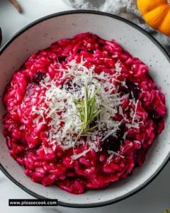 Delicious Bloody Beet Risotto served in a bowl with fresh herbs.