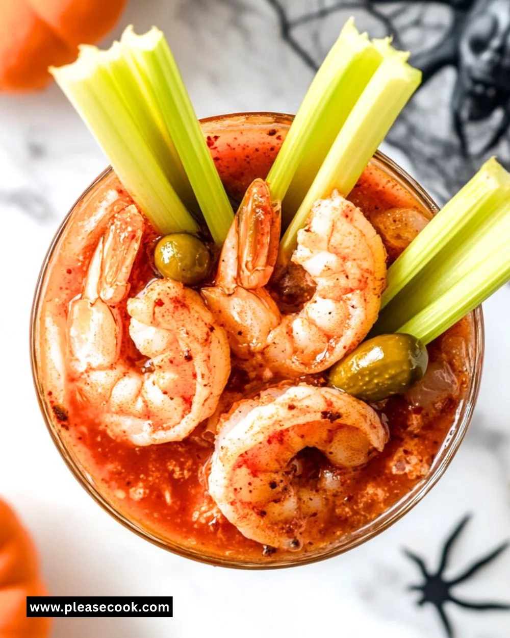 Delicious Bloody Mary Shrimp Cocktail served in a glass with garnishes