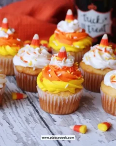 Delicious Candy Corn Funfetti Cupcakes topped with colorful frosting.