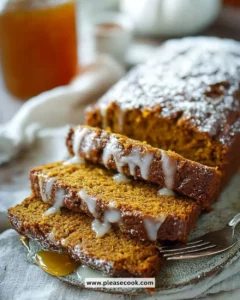 Chai Spice Maple Pumpkin Bread on a wooden cutting board