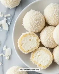 Delicious creamy no bake coconut balls on a serving plate