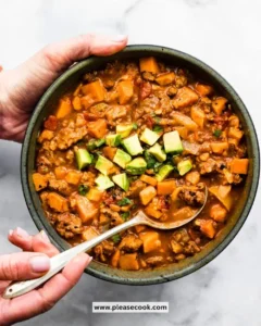 Bowl of Crockpot Sweet Potato Chili with fresh toppings
