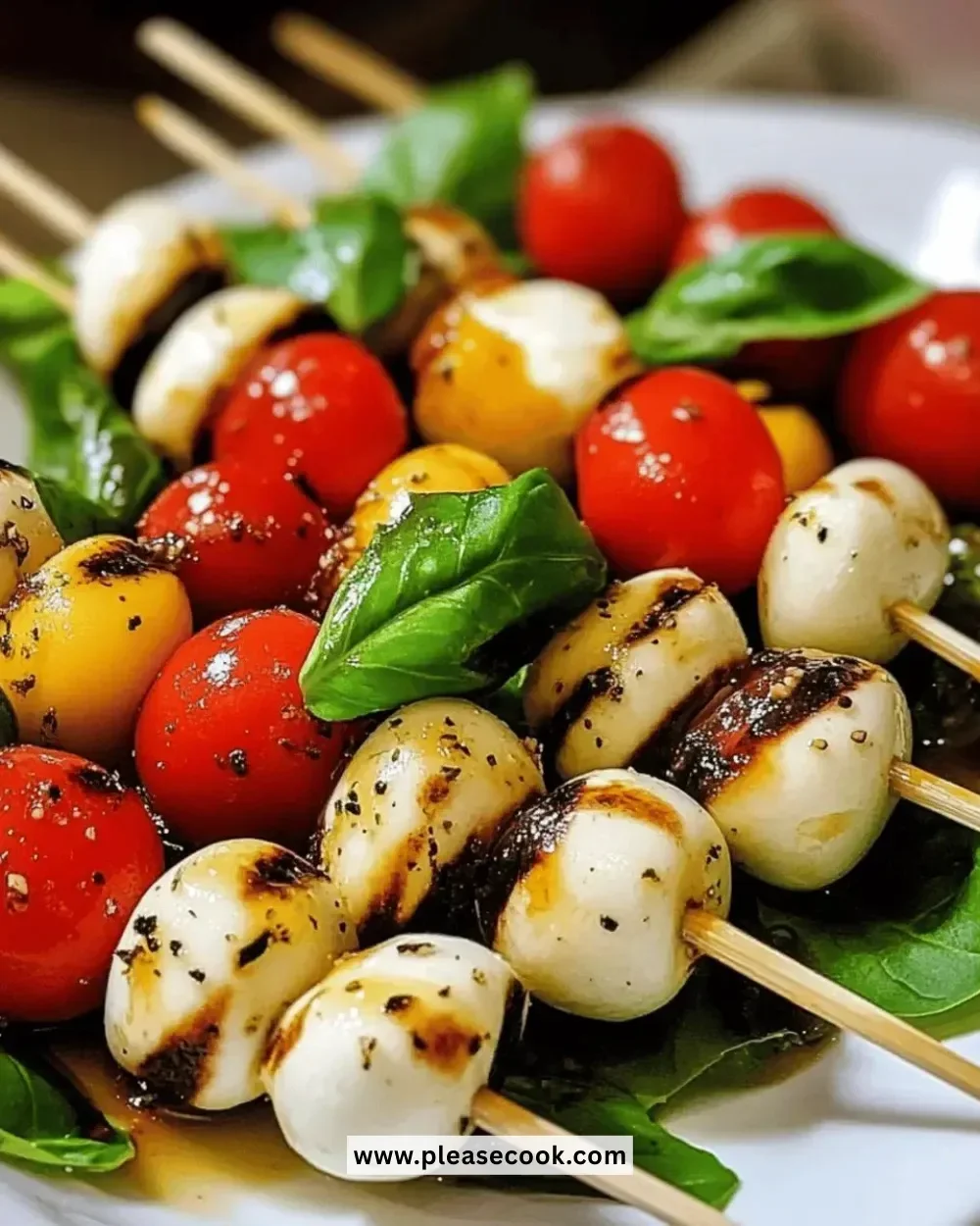 Easy fresh mini Caprese skewers with tomatoes, mozzarella, and basil on skewers
