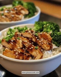 Easy juicy teriyaki chicken rice bowls garnished with green onions and sesame seeds