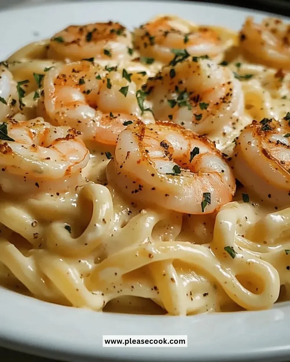 Delicious Easy Shrimp Alfredo Pasta served with fresh herbs