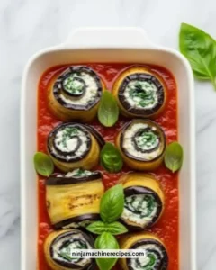 Eggplant Roll-Ups stuffed with creamy ricotta and spinach on a plate