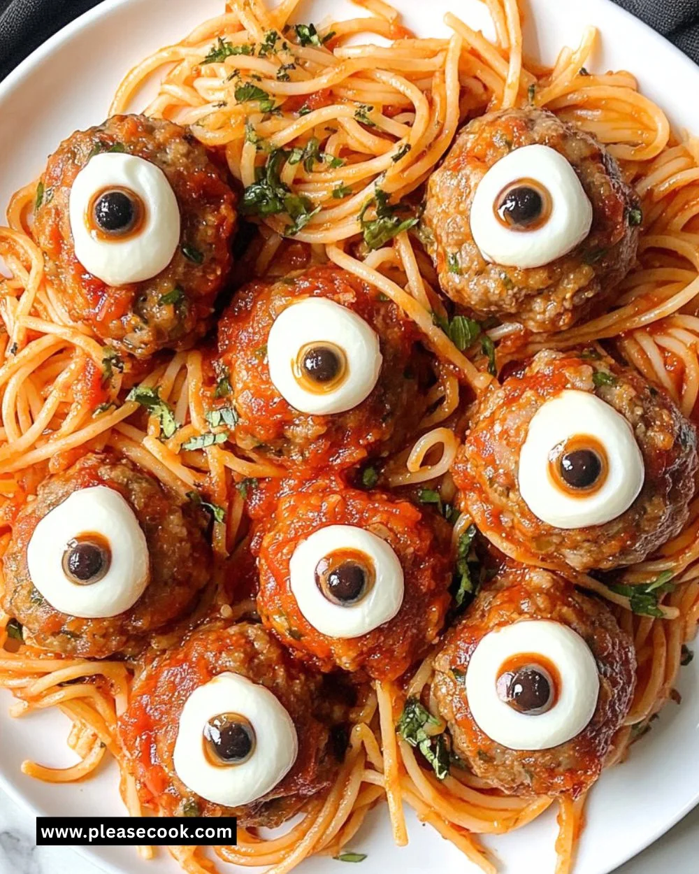 A spooky Eyeball Pasta with mozzarella balls resembling eyes, perfect for Halloween.