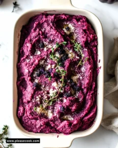 A spooky, gory twist on classic Shepherd's Pie served in a dark-themed dish.