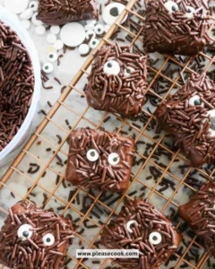 Delicious Halloween brownies decorated with spooky motifs and festive colors.