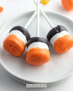 Colorful Halloween marshmallow pops decorated with spooky designs