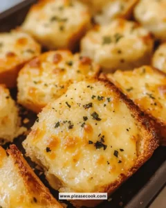 Irresistible crispy cheesy garlic bread bites served on a plate