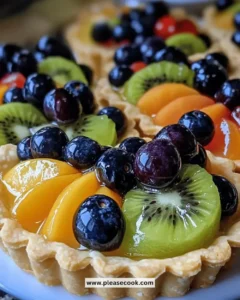 Irresistible mini fruit tartlets topped with fresh fruits and creamy filling