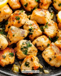 Delicious Lemon Garlic Chicken Bites garnished with fresh herbs