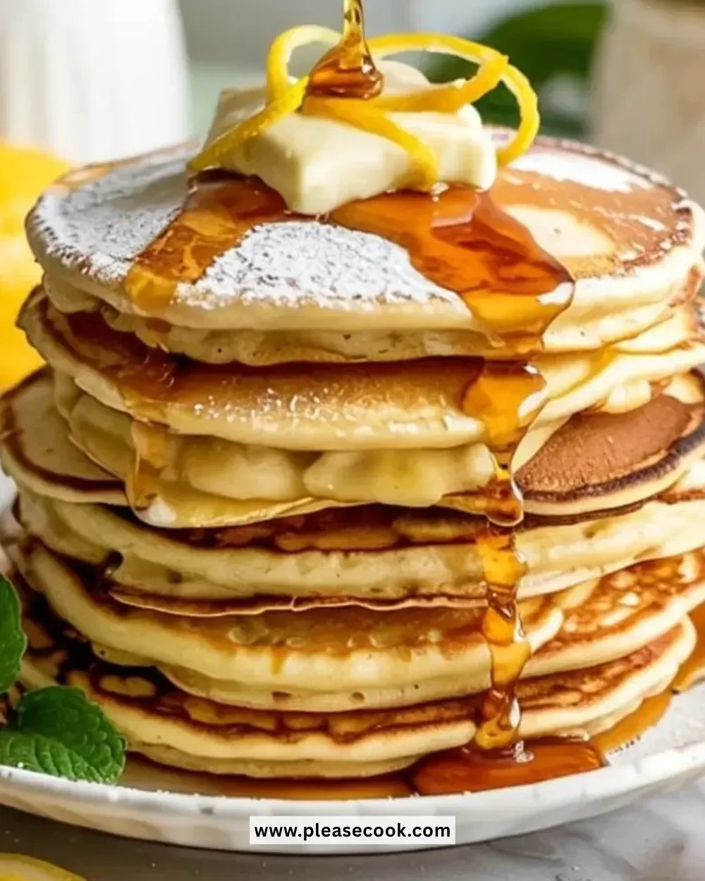 Delicious lemon ricotta pancakes served with fresh fruit and syrup