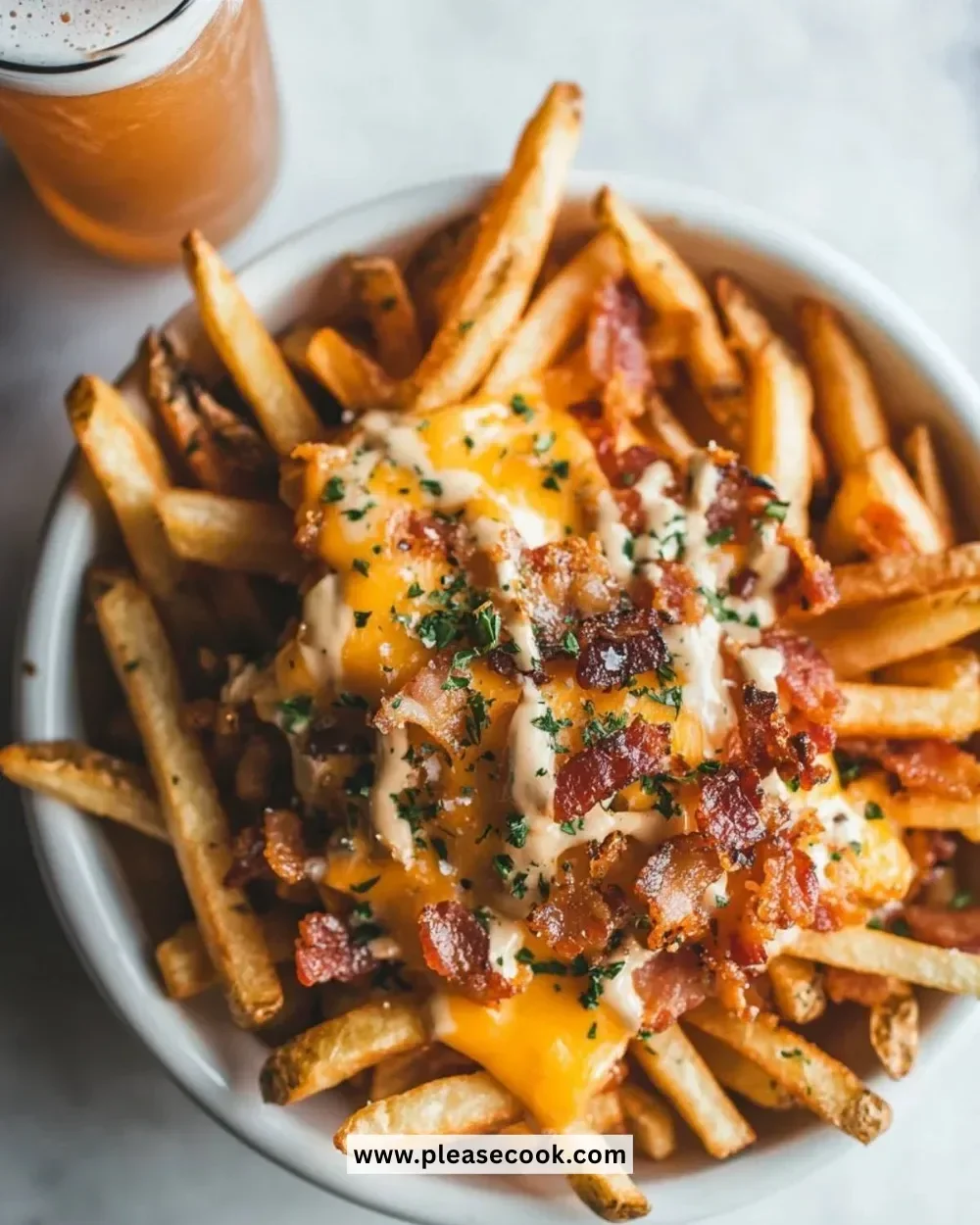 Delicious loaded fries topped with bacon, cheddar cheese, and ranch dressing