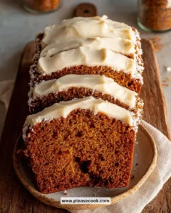 Delicious pumpkin bread with cream cheese frosting served on a plate