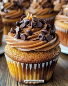 Delicious pumpkin chocolate chip cupcakes topped with chocolate frosting.