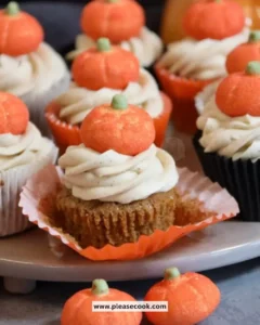 Homemade Pumpkin Spice Cupcakes with frosting and autumn decorations