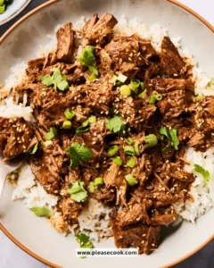 Delicious Slow Cooker Korean Beef served with rice and vegetables.