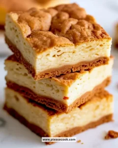 Delicious snickerdoodle blondies topped with cinnamon sugar on a plate