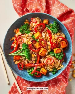 Spicy Butternut Squash Pad Thai dish served with lime and peanuts