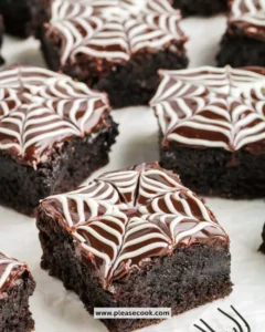Delicious Spiderweb Brownies decorated with chocolate web design on top