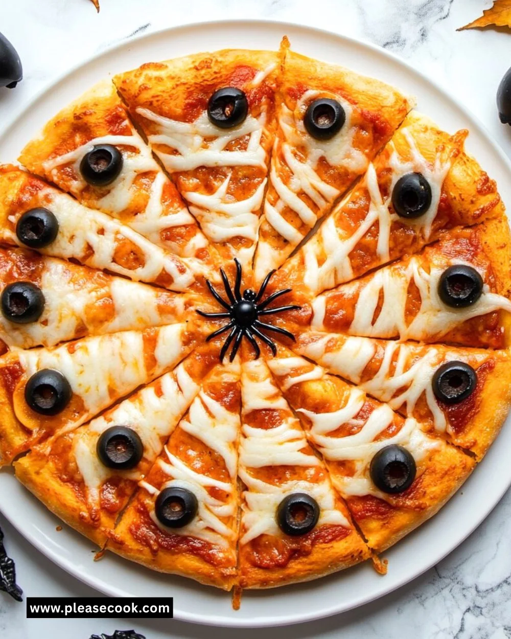 Spiderweb Halloween Pizza decorated with cheese and olives for spooky festivities.