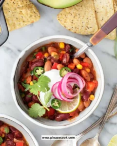 Bowl of hearty Vegetarian Chili garnished with fresh herbs