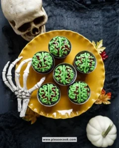 Zombie Brain Halloween Cupcakes decorated with gooey icing and edible details