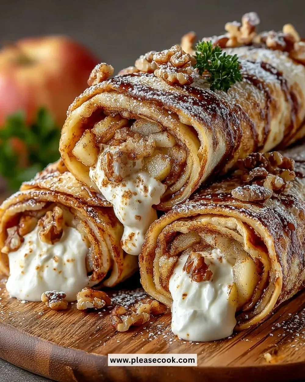 Freshly made apple cinnamon roll-ups displayed on a plate