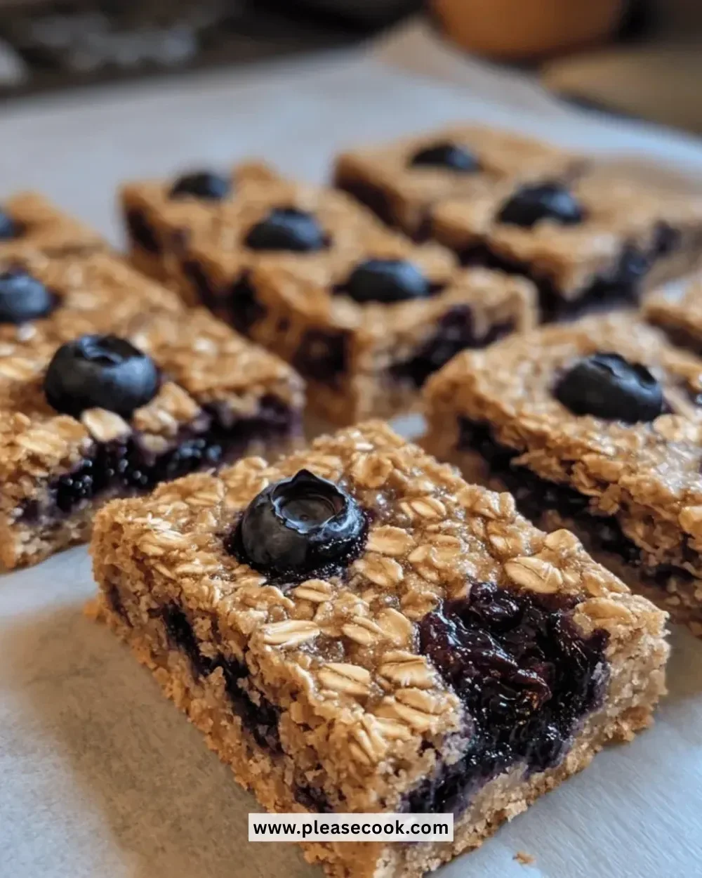 Delicious baked oatmeal blueberry bars on a wooden table