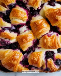Blueberry cream cheese croissant casserole served in a dish