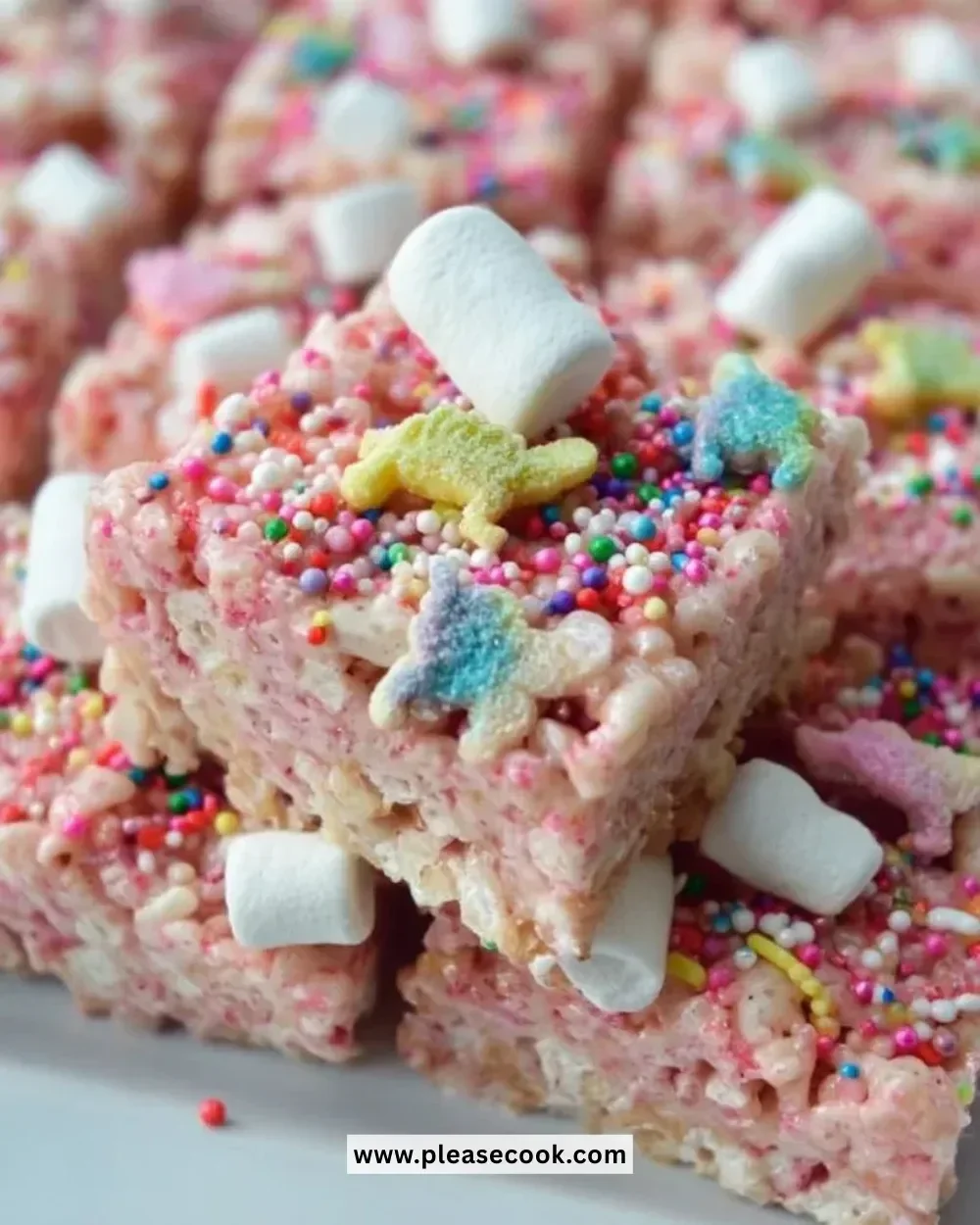 Colorful Circus Animal Cookie Rice Krispie Treats stacked on a plate