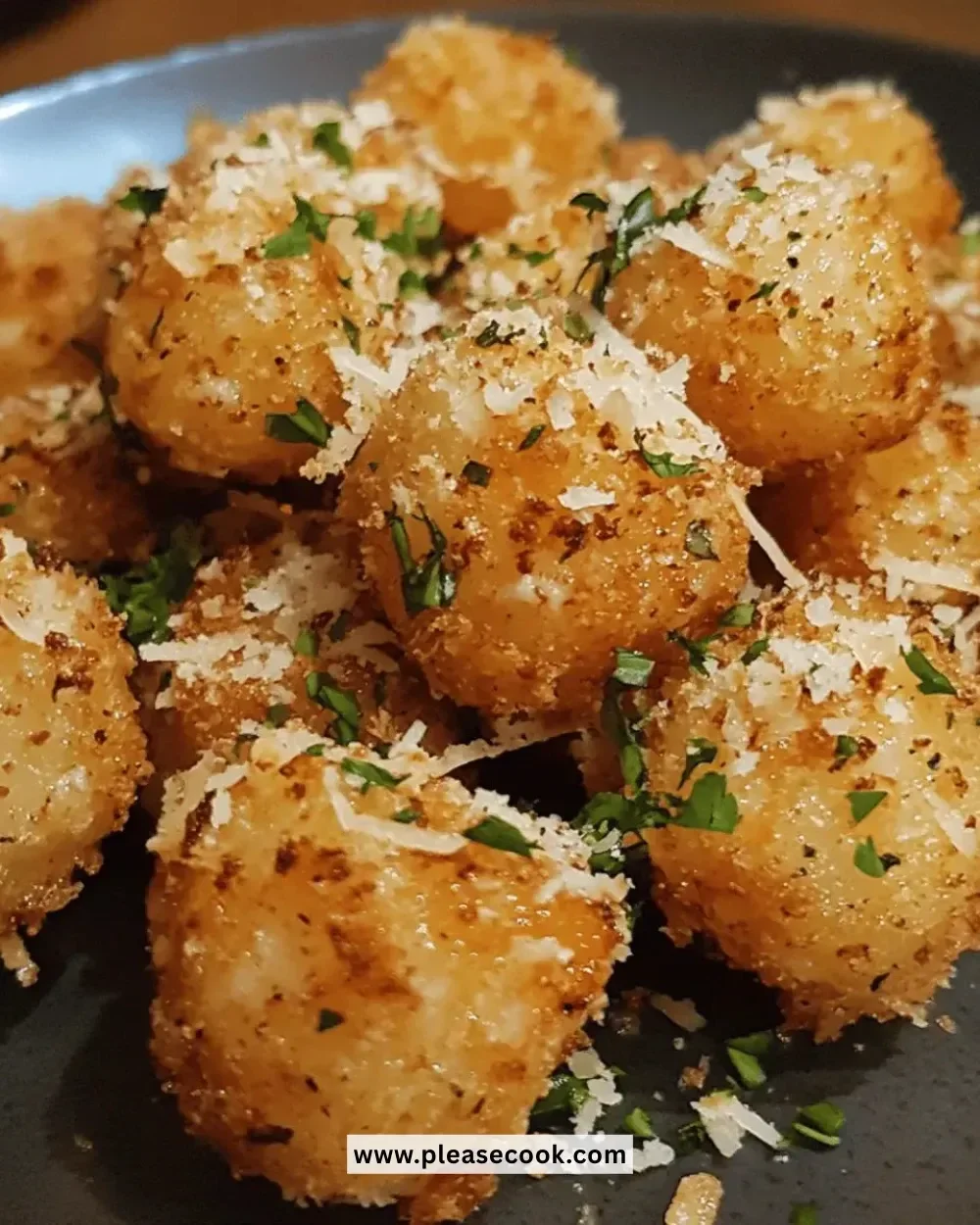 Image of crispy garlic parmesan bites served on a plate