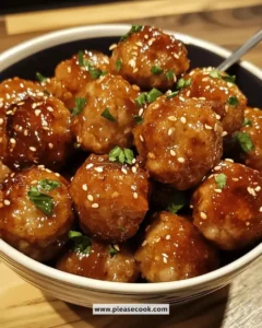 Plate of easy honey garlic chicken meatballs drizzled with sauce