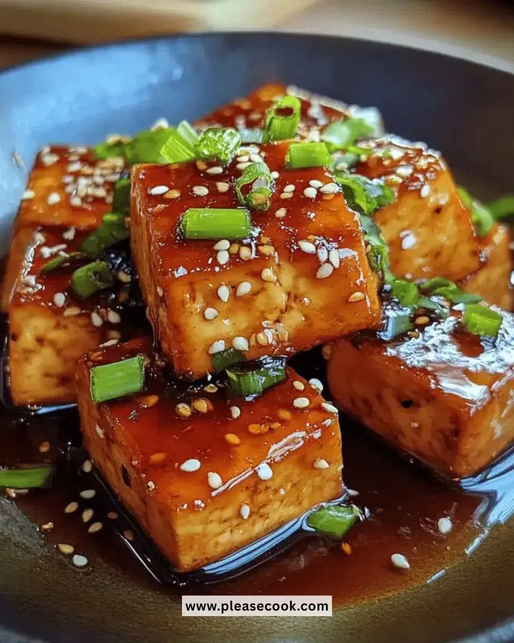 Delicious honey soy glazed tofu served on a plate with vegetables