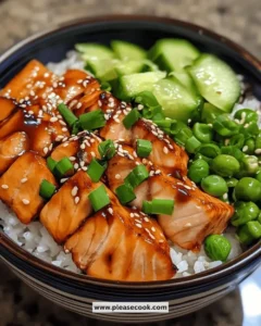 Delicious easy quick teriyaki salmon bowl topped with sesame seeds and green onions