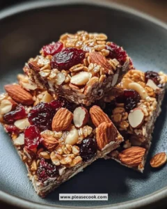 Healthy roasted almond snack clusters with cranberries on a plate