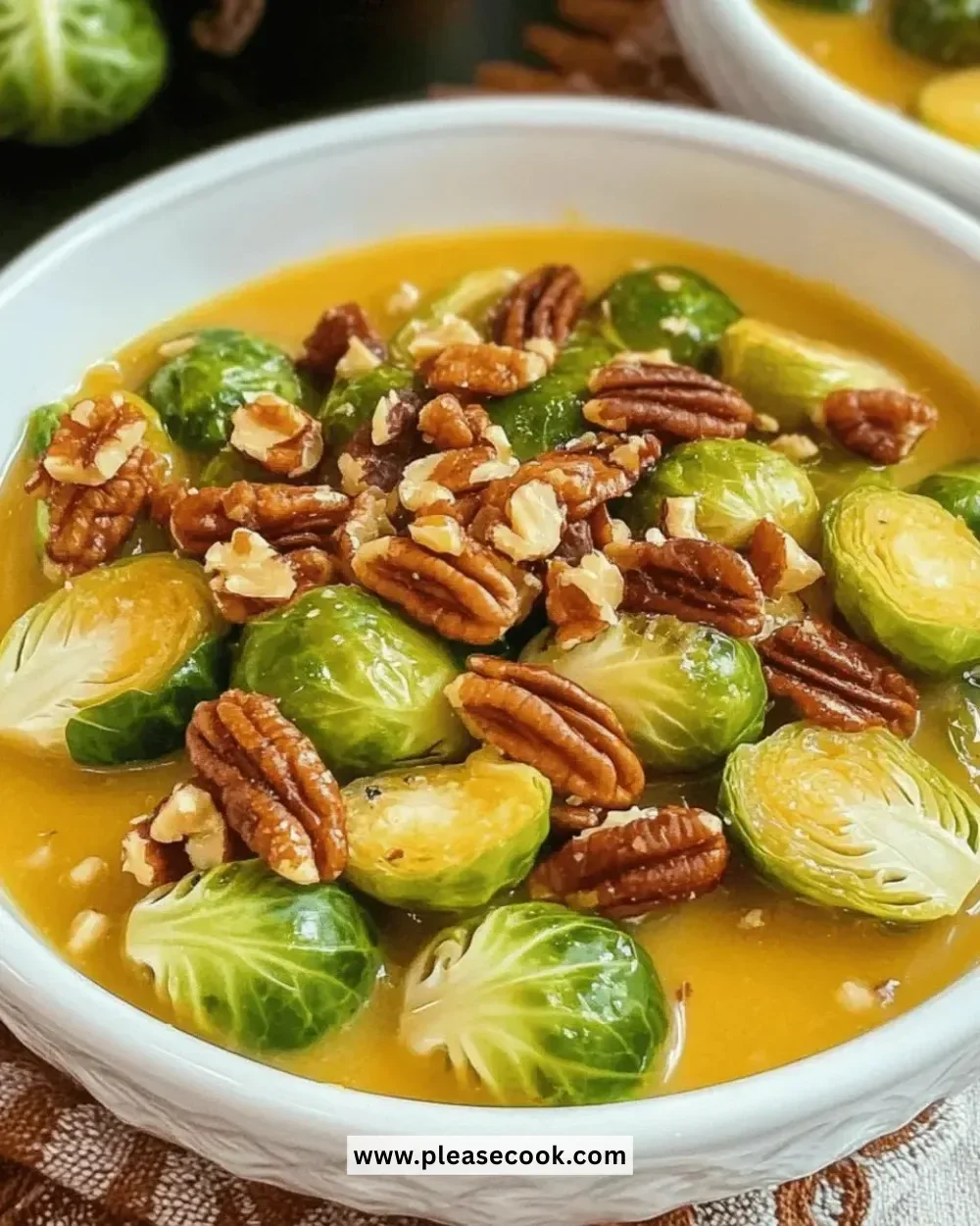 Easy Thanksgiving maple pecan Brussels sprouts dish garnished with pecans