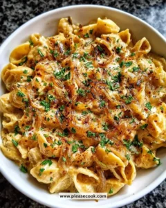 Creamy French Onion Pasta topped with melted cheese and herbs