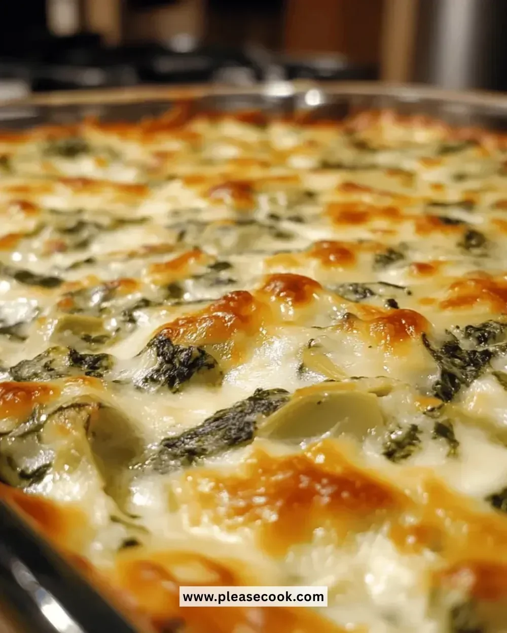 Bowl of irresistibly cheesy spinach artichoke dip served with tortilla chips