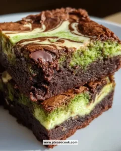 Delicious matcha cheesecake swirl brownies topped with green matcha cream.
