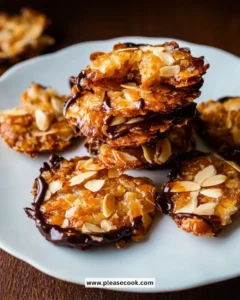 Delicious quick Florentines made with nuts and chocolate on a baking tray.